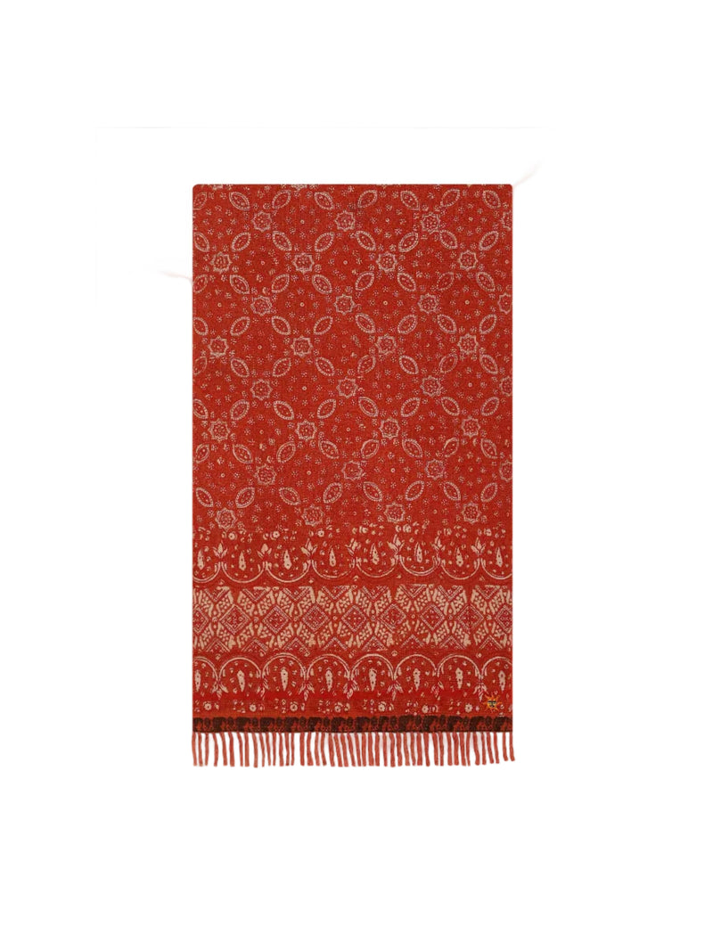 Red patterned scarf with white designs on a white background