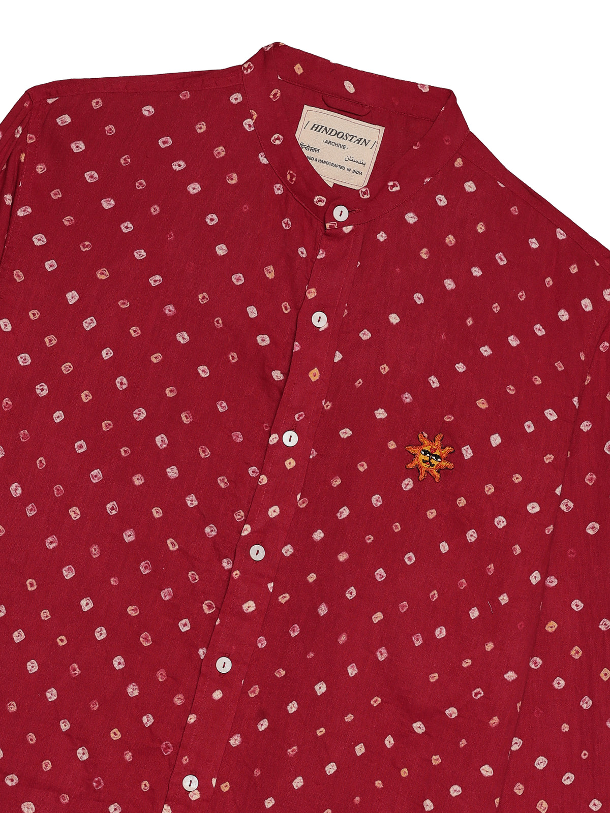 Close-up of Red Bandhani Shirt band collar and mother-of-pearl button placket | Hindostan Archive
