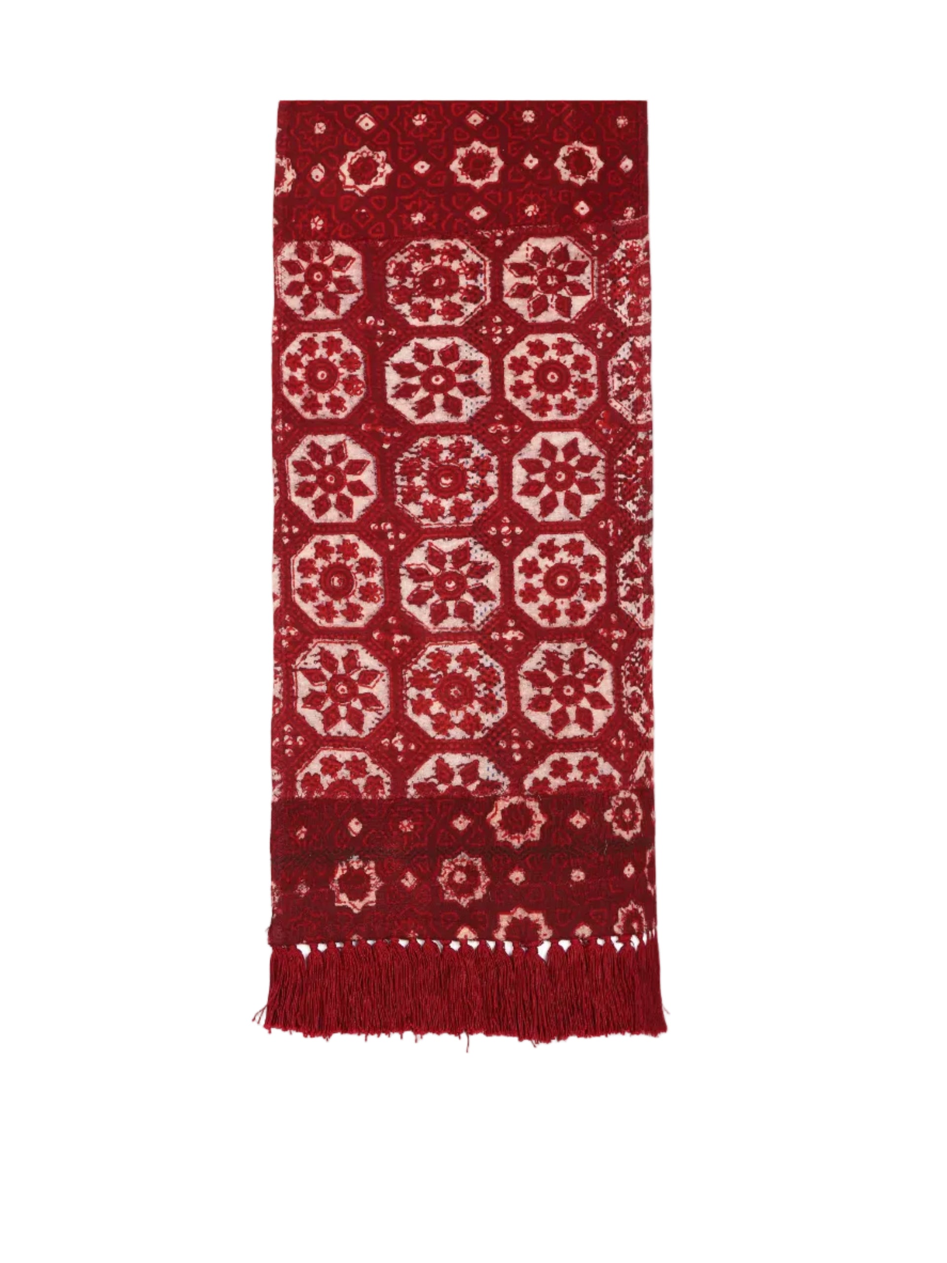 Red patterned scarf with white designs on a white background
