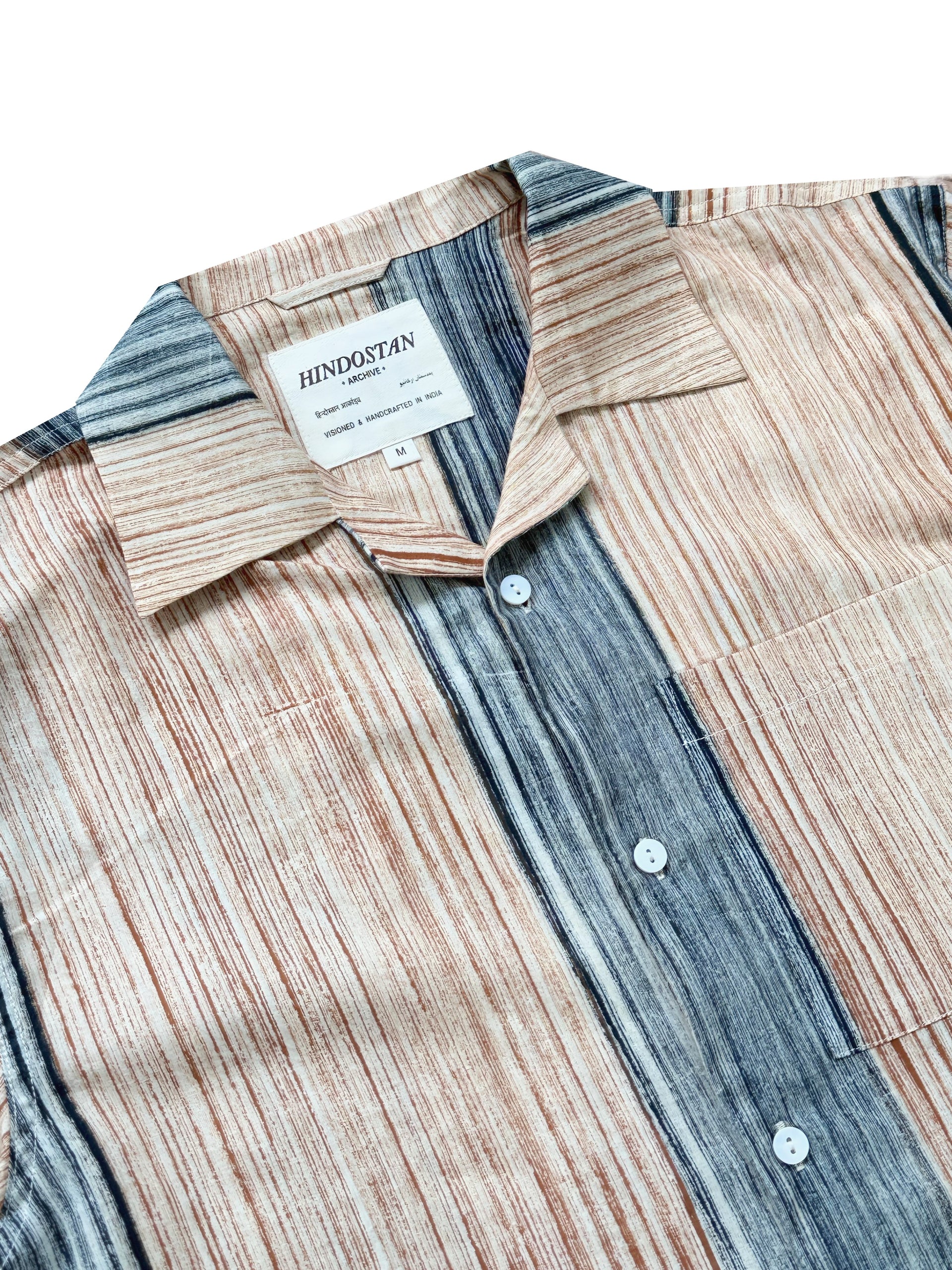 Patterned shirt with a visible brand label on a white background