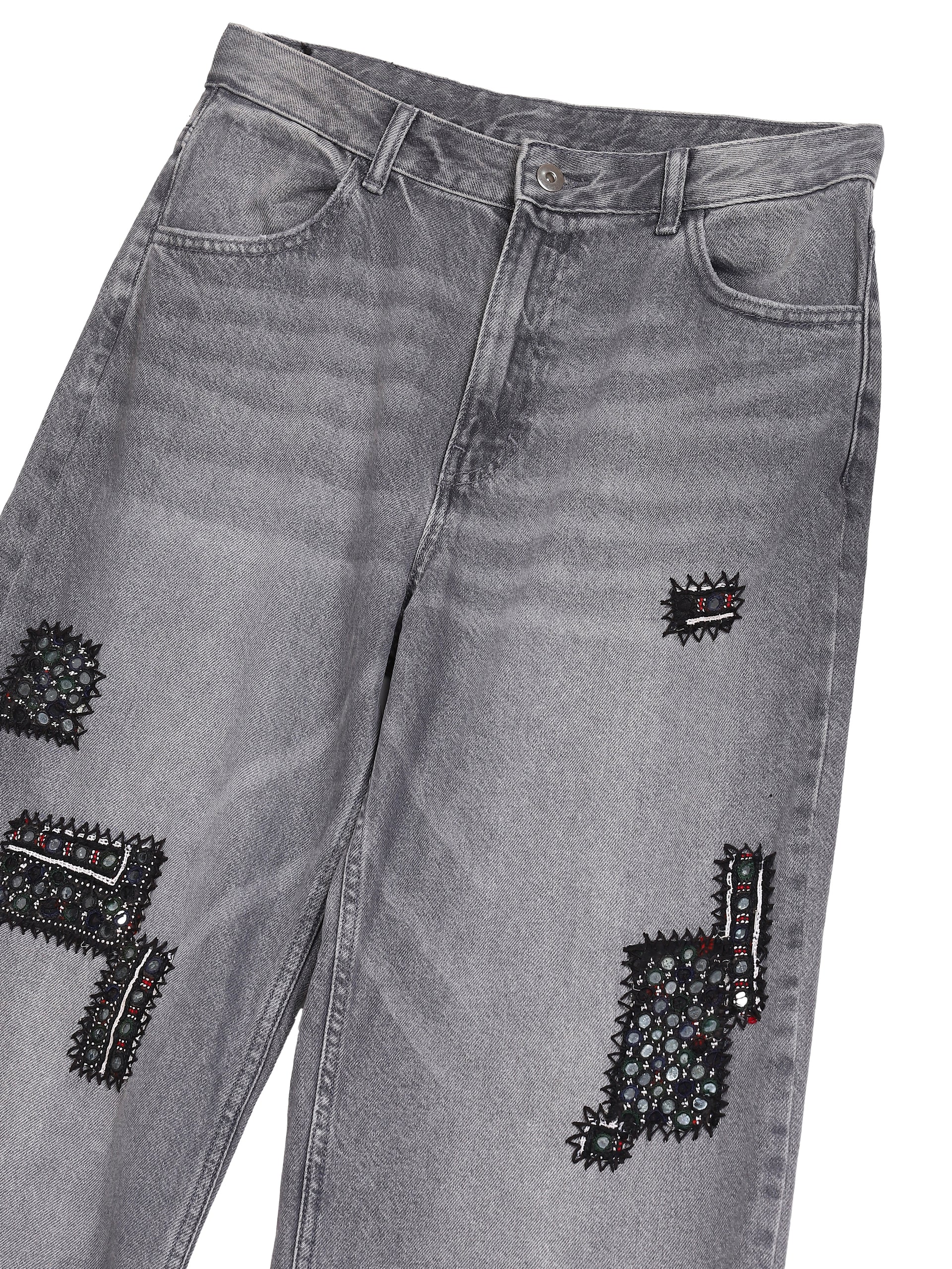 Banjara patchwork jeans close-up embroidered patches detail – vintage denim artisan menswear Indian handloom by Hindostan Archive