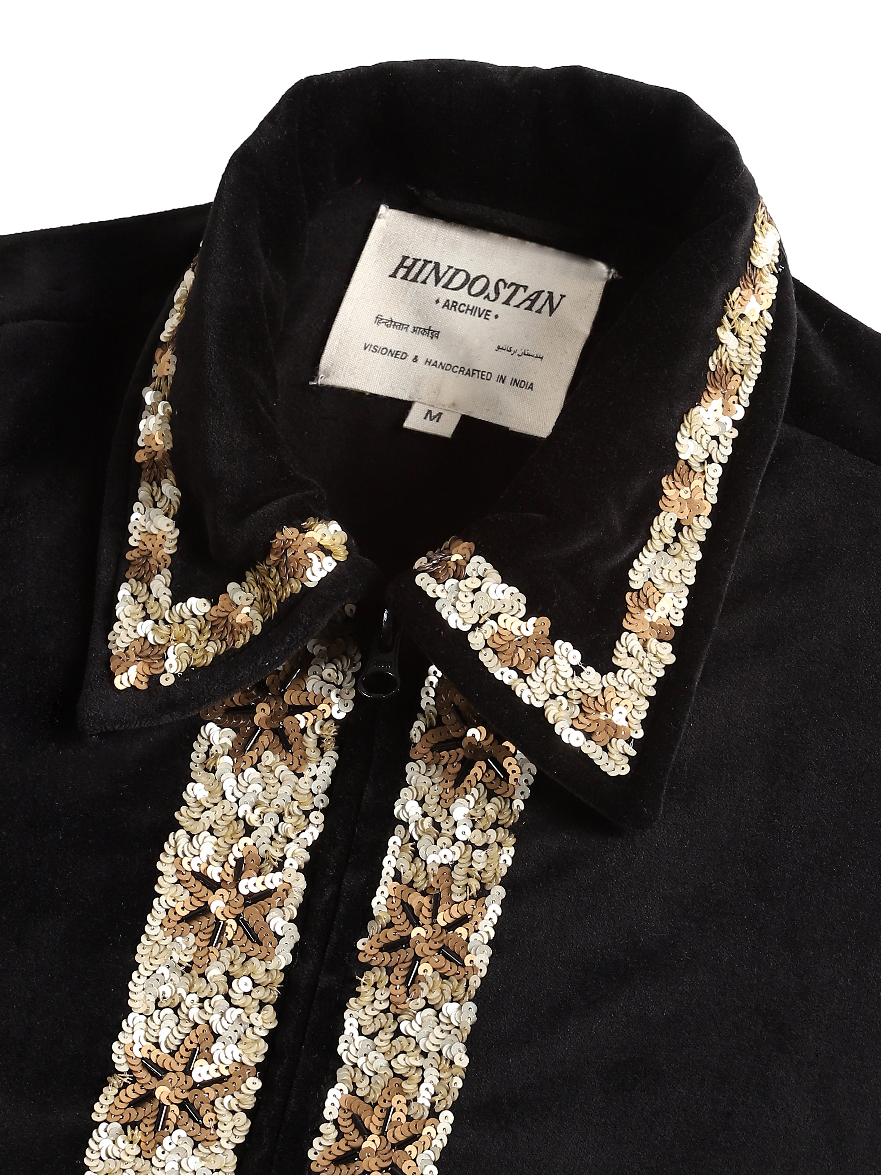 Black velvet jacket collar close-up with hand-embroidered sequin detail – artisan menswear Indian handloom by Hindostan Archive