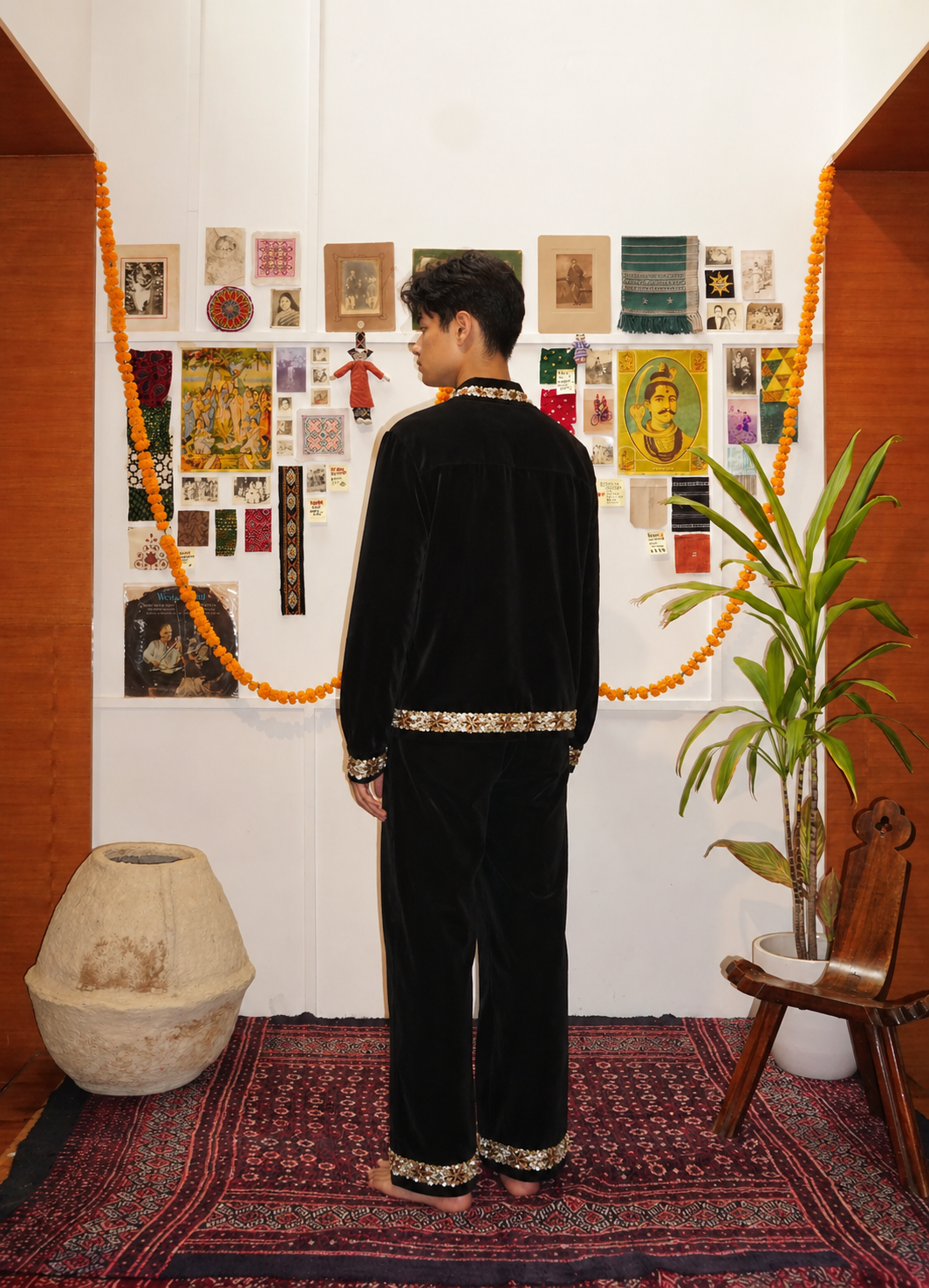 Black velvet trousers back view lifestyle shot – artisan menswear Indian handloom clothing with gold sequin by Hindostan Archive