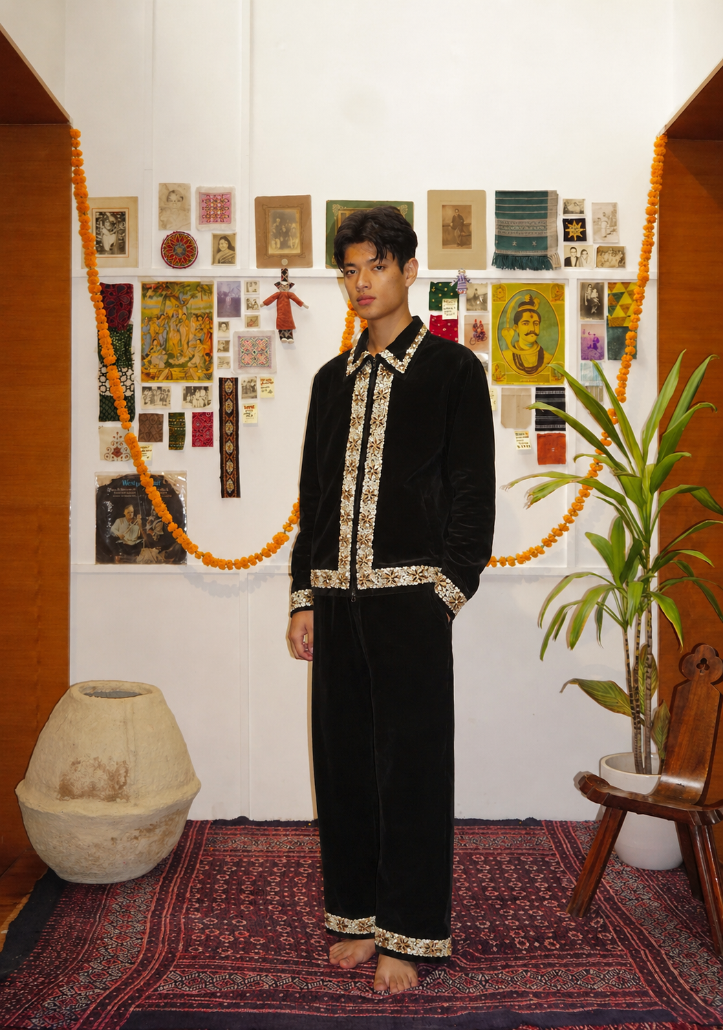 Black velvet trousers lifestyle shot – artisan menswear Indian handloom clothing with gold sequin embroidery by Hindostan Archive