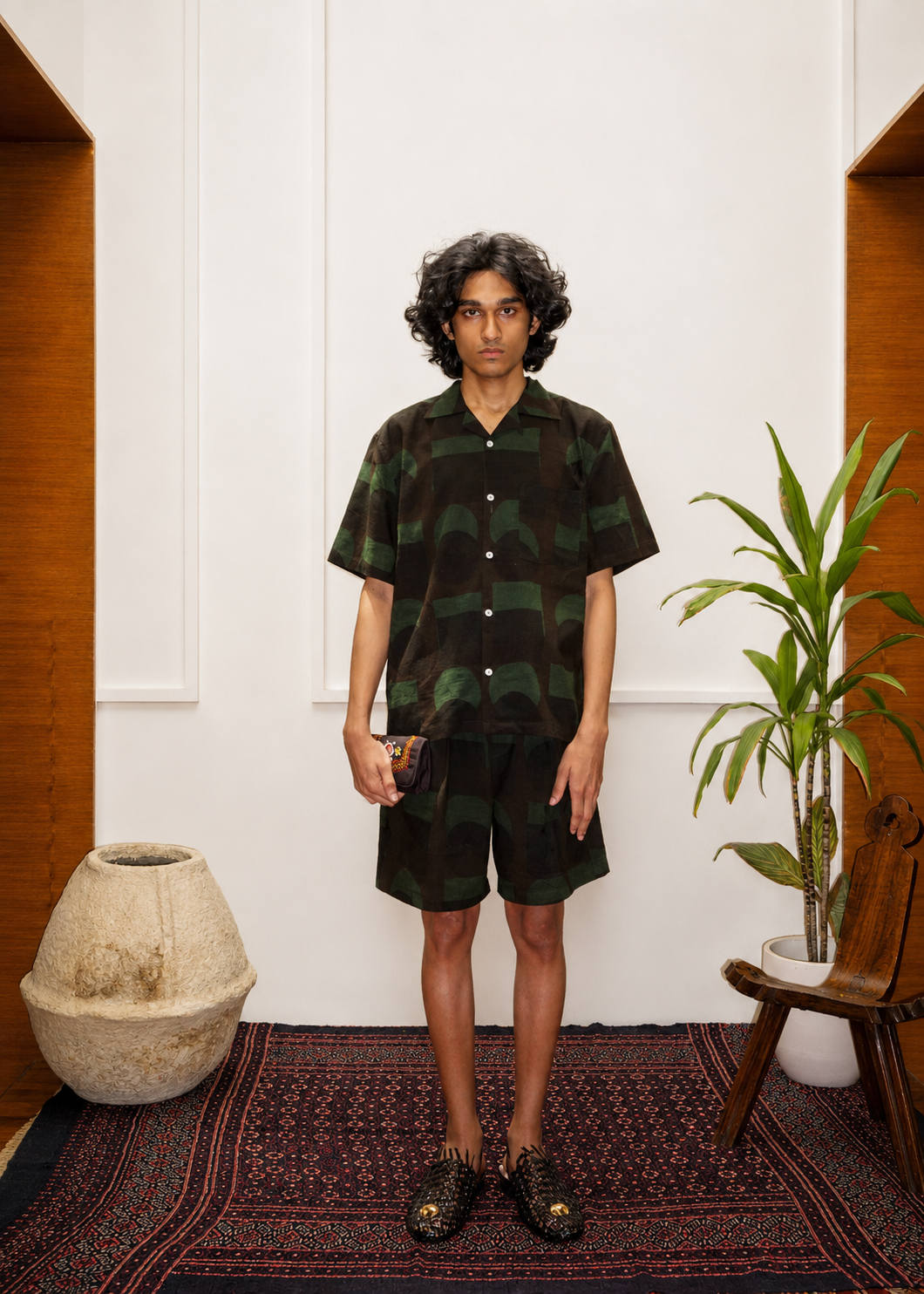 Model wearing Crescent Ajrakh shorts – Ajrakh clothing hand block printed natural dyed shorts – artisan menswear Indian handloom by Hindostan Archive