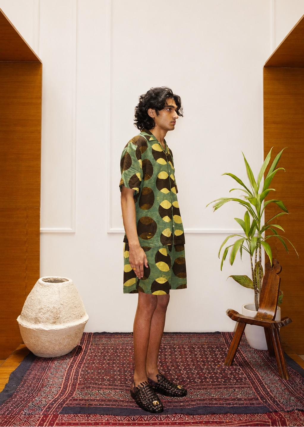 Cricket Ajrakh shorts side view lifestyle shot – hand block printed natural dyed Ajrakh clothing artisan menswear by Hindostan Archive