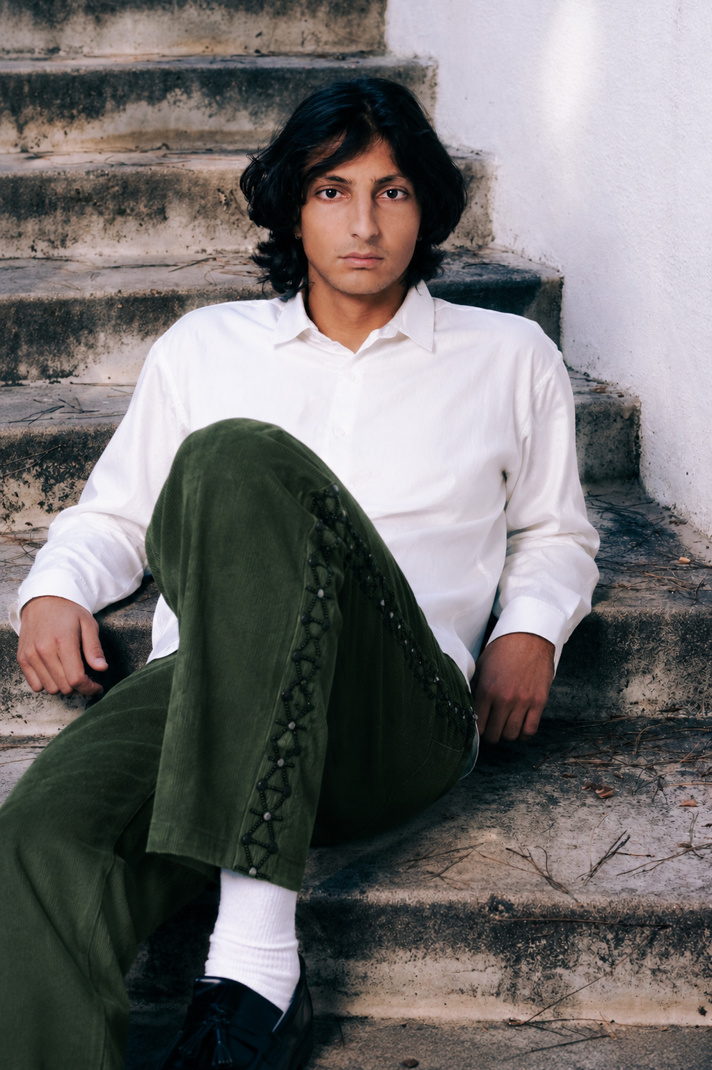 Model wearing embroidered corduroy trousers lifestyle shot – hand-embroidered Indian handloom artisan menswear by Hindostan Archive