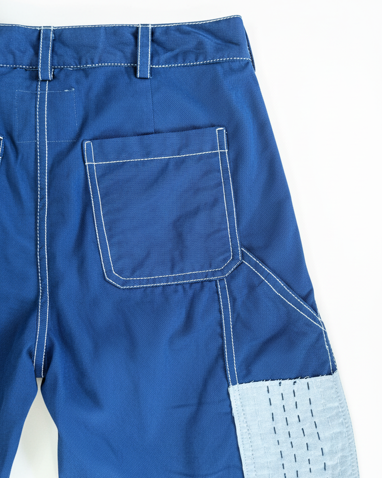 Back pocket detail of indigo carpenter cotton shorts with Kantha stitch patch – artisan menswear by Hindostan Archive