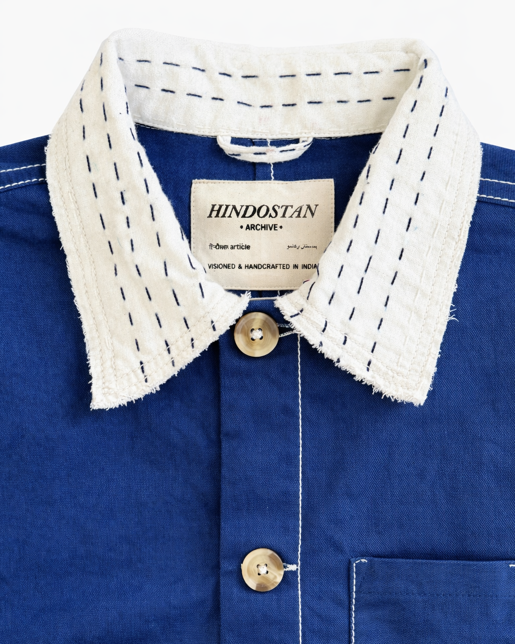 Collar and label detail of Indigo Kantha quilted shacket jacket with Kantha running-stitch – Hindostan Archive artisan menswear