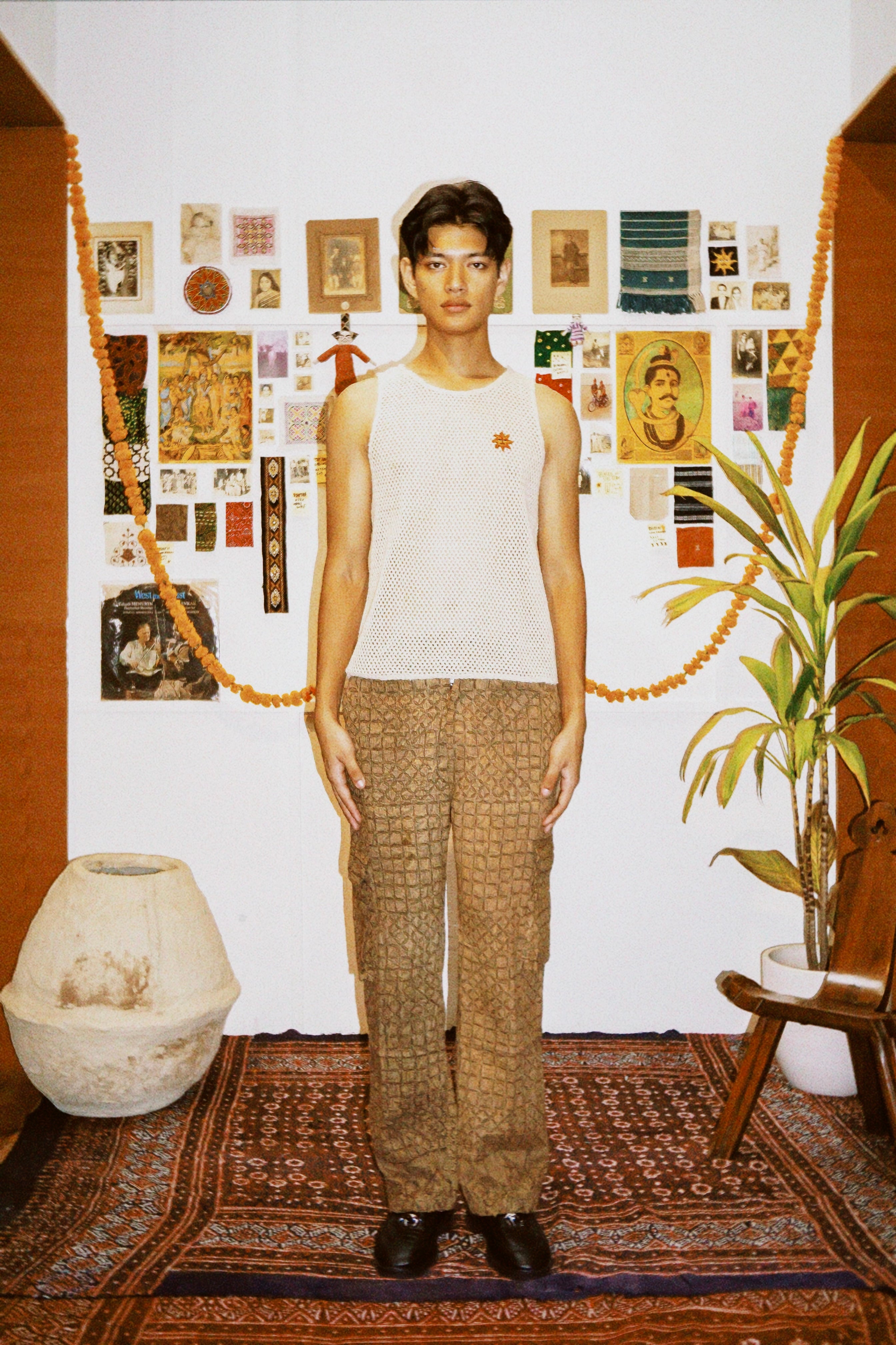 Model wearing Rilli brown cargo trousers – patchwork natural dyed cotton cargo trousers lifestyle shot – artisan menswear Indian handloom clothing by Hindostan Archive