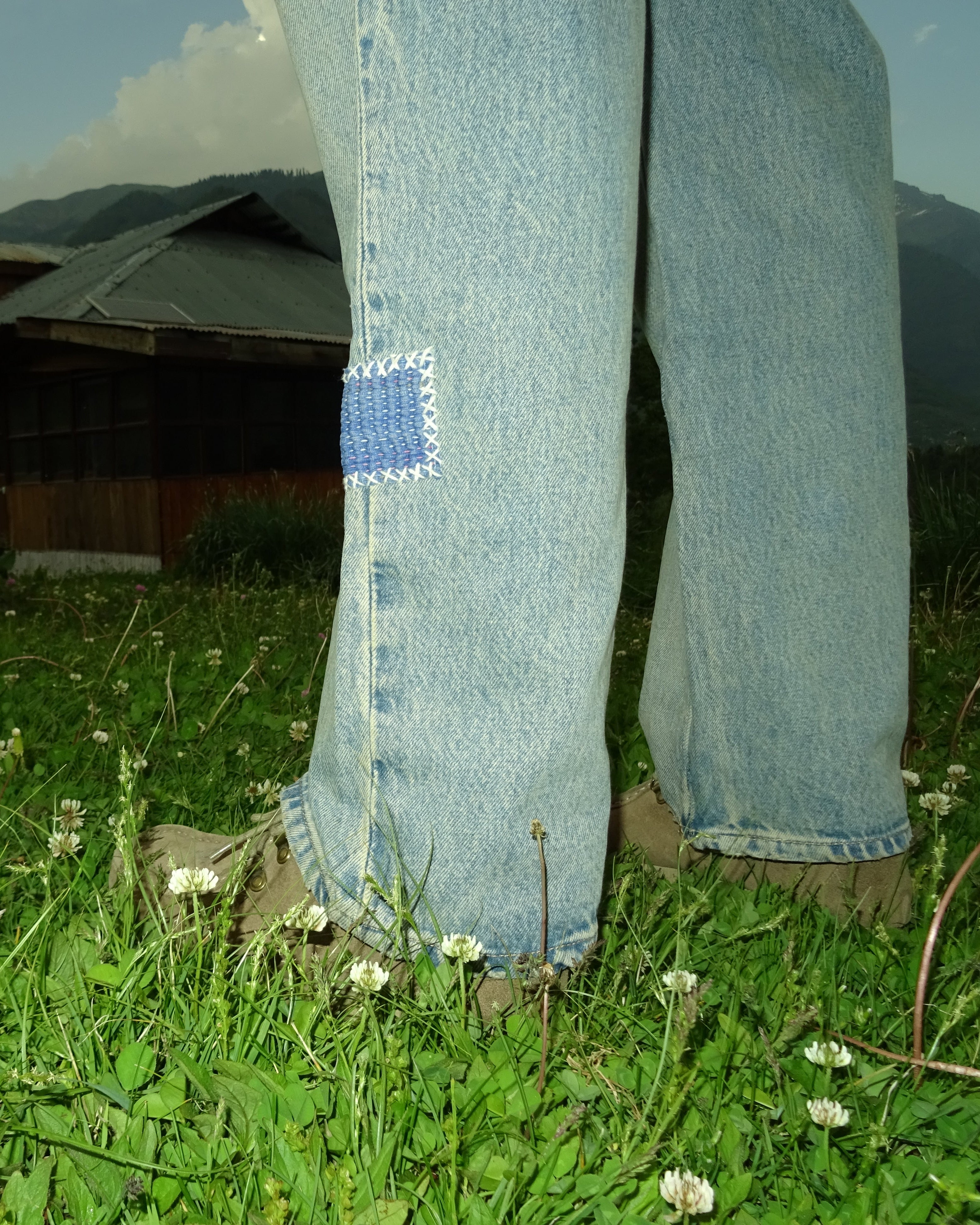 Vintage patchwork jeans detail patch shot outdoors – artisan menswear natural dyed Indian handloom clothing by Hindostan Archive
